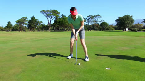 couple playing golf