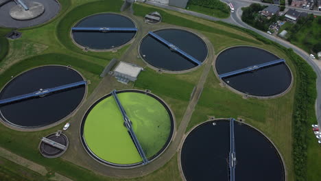 aerial view of a wastewater treatment plant with algae