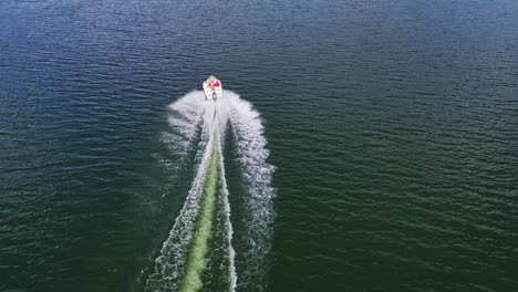 aerial view of boat on river. drone view of motor boat sailing on river