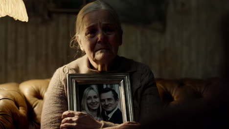 elderly woman looking at a photo