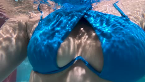 young women in the pool underwater shoot