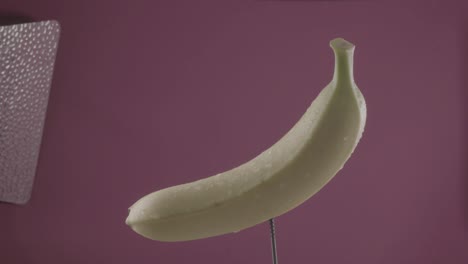 banana rotating with loop on fuchsia screen for chroma key