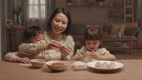 family making dumplings together