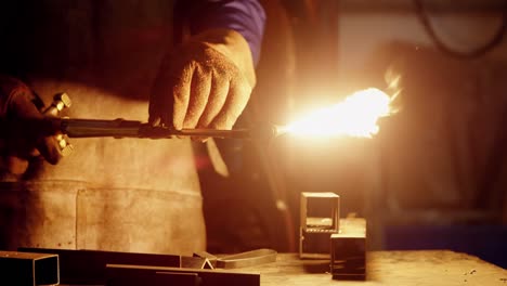 welder holding welding torch