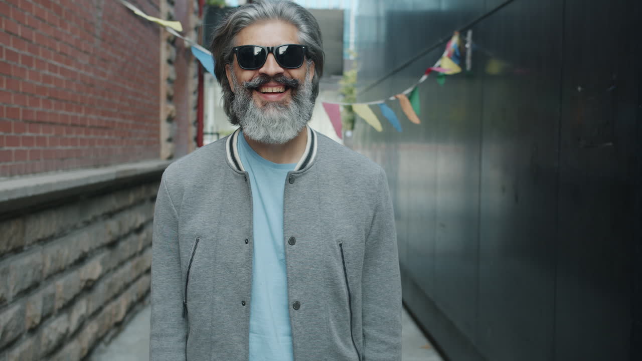Smiling Man with Thumbs Up in an Urban Alley