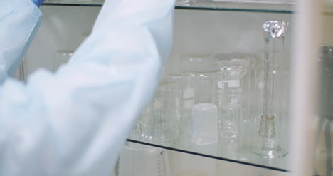 Scientist-Looking-For-Flask-At-Laboratory-3