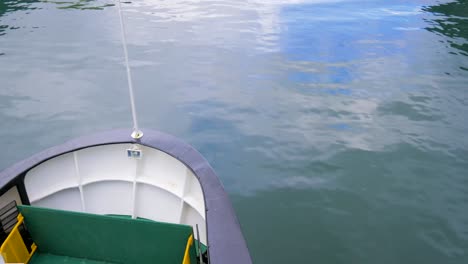 a norwegian cruise ship exploring a calm fjord on a clear summer day.