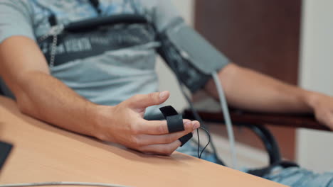 man's hands connected to the lie detector circuit