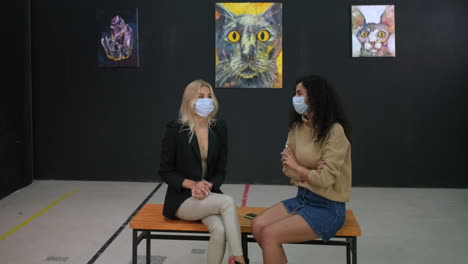 two women visiting an art gallery during pandemic