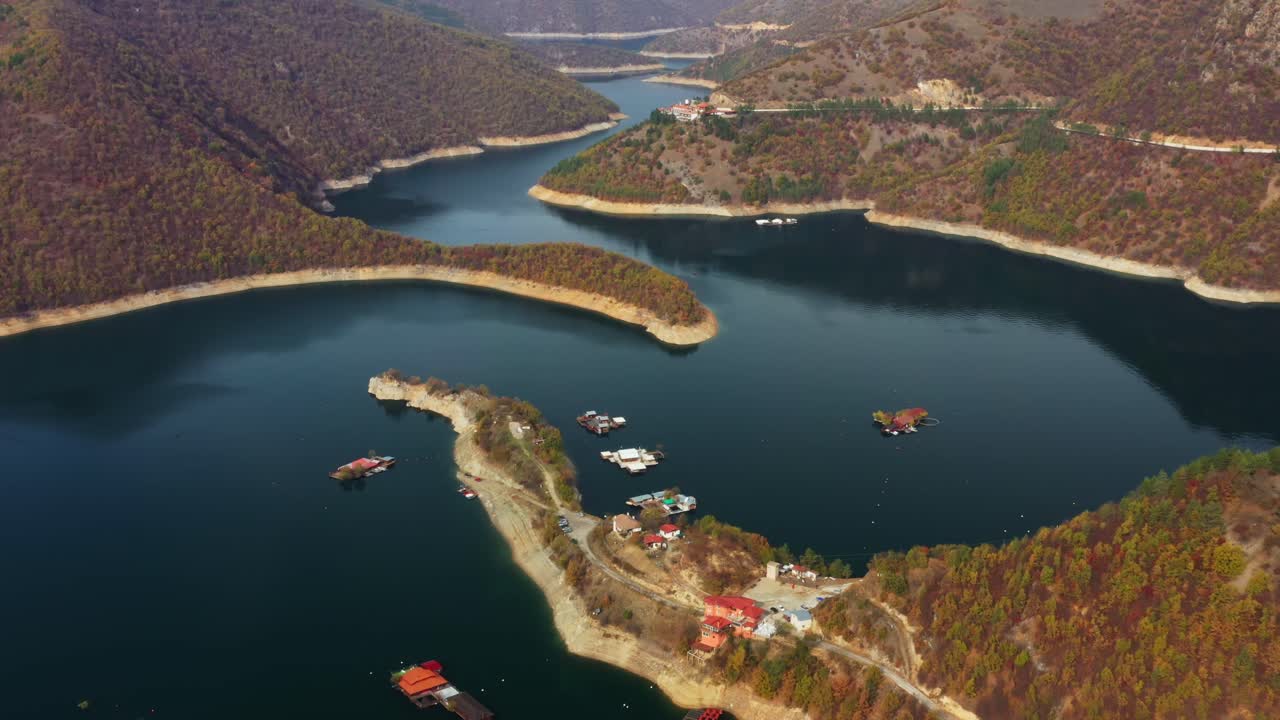 Aerial View of a Serene Lake and Mountains in Autumn