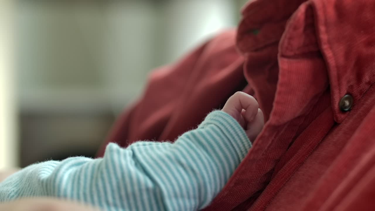 Man Holding Newborn Baby - Focus on Little Arm and Hand SLOMO