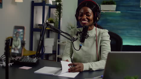 african creator content waving at camera smiling and talking with audience