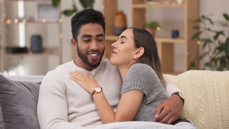 Happy,-love-and-couple-relaxing-on-a-sofa-talking