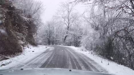 driving in winter heavy snow in iran hyrcanian forest rural village road countryside landscape mountain nature snowy landscape vehicle tracks icy roads cold season pov rural travel winter driving