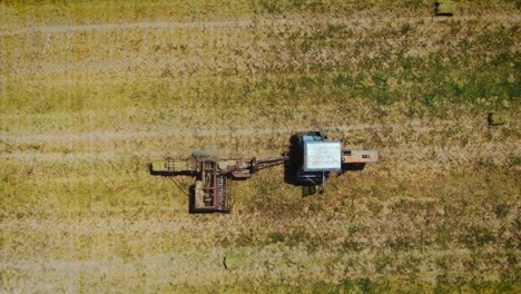 Tractor-Baling-Hemp-Straw-In-The-Meadow-After-Harvest