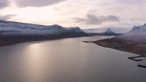 astonishing aerial view of iceland fjord landscape above sea, sunset, lowering