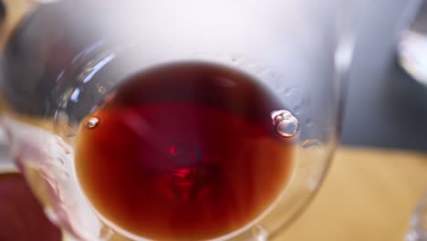 red wine swirling in a glass