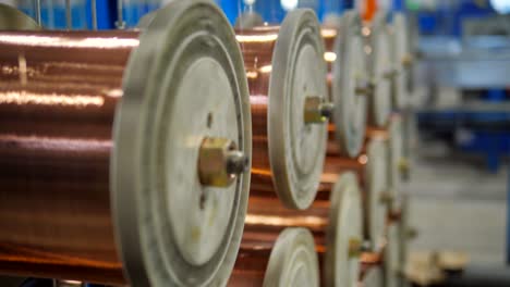 copper wire winding on coils on industrial machines at factory.