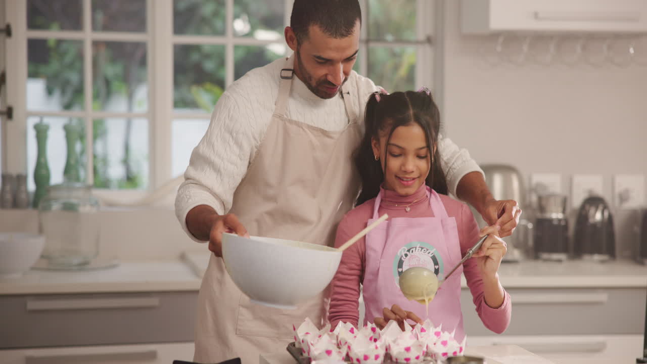 Father and Daughter Baking Cupcakes Together