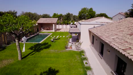 slow aerial establishing shot of a luxury villa in st siffret with a private pool