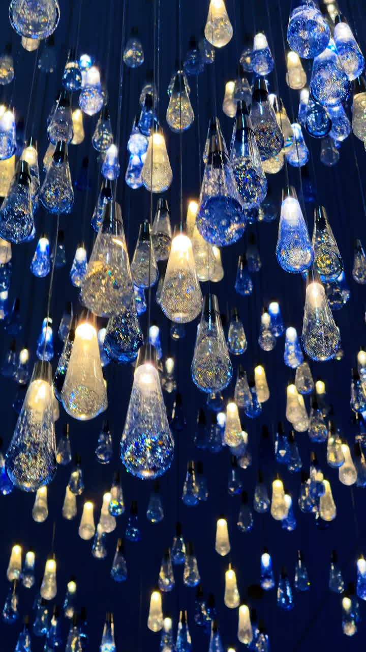 Stunning glass hanging lights. A striking arrangement of glass light fixtures creates a stunning visual effect in a dark environment