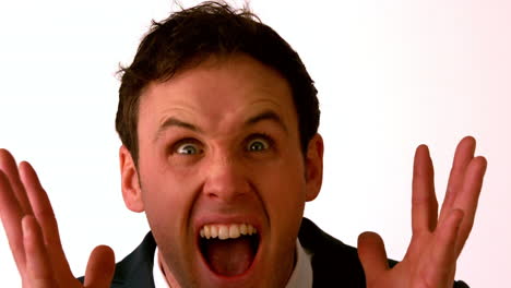 Angry-businessman-shouting-at-camera