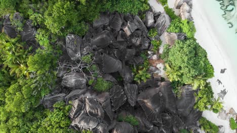 Aerial-view-of-Anse-Source-d’Argent,-La-Digue,-Seychelles-shot-in-the-early-morning-hours-with-no-people-on-the-beach