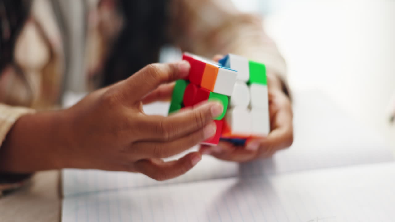 Child solving a Rubik's cube