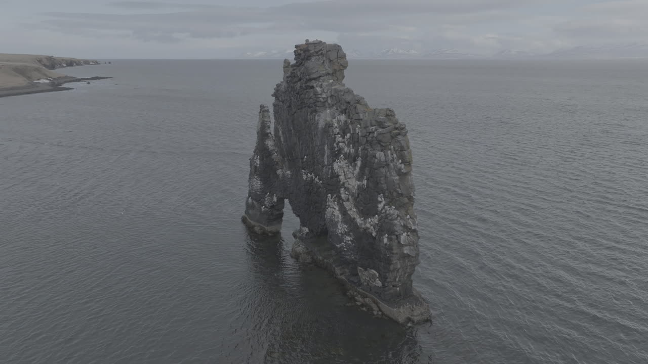 Aerial View of Hv&iacute;tserkur, Famous Natural Landmark of Iceland, Basalt Rock in the Sea, Drone Shot