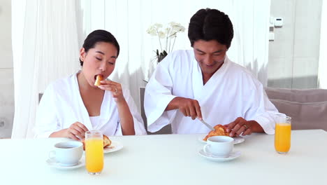 asian couple having breakfast together