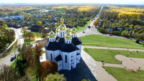 4k  aerial. fly around   christian  orthodox church, autumn city. circular novement