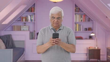 Angry-Indian-old-man-chatting-with-someone