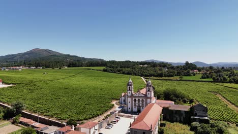 mosteiro de rendufe surrounded by lush vineyards in amares minho portugal - drone