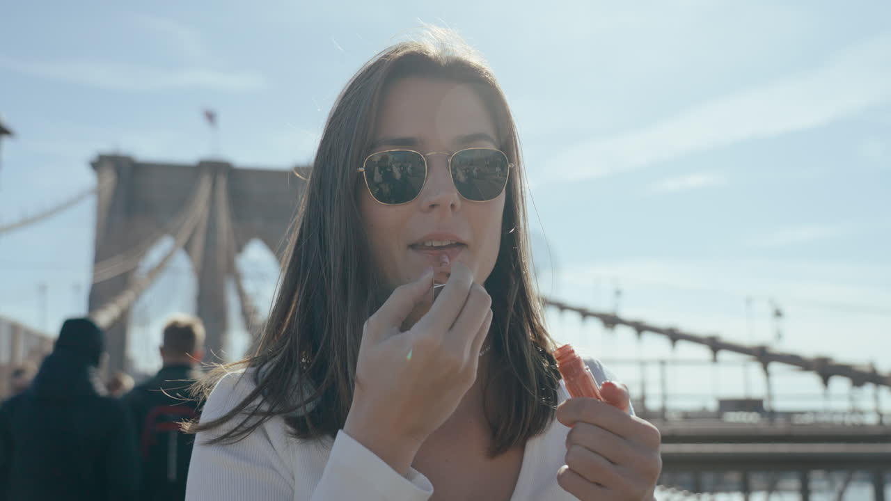 Woman Applying Lipstick in New York City