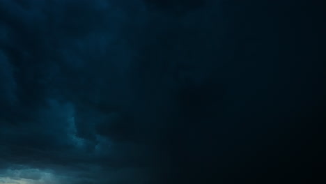 dark stormy sky with faint lightning