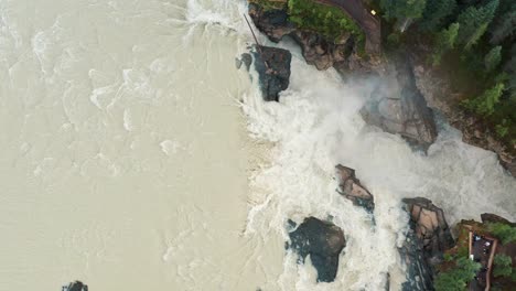 Aerial-Pass-of-Athabasca-Falls-in-Jasper,-Alberta,-Canada---4K-Rushing-River-Flow---Tourism-and-Destination-Spots