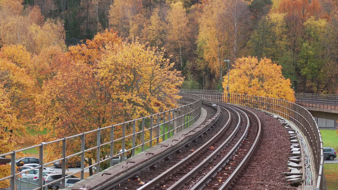 Empty subway train tracks in an autumn season setting