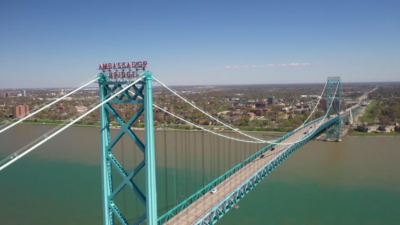 Ambassador Bridge connecting Detroit, Michigan in the United States of America and Windsor, Ontario in Canada drone video pulling out