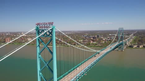 ambassador bridge connecting detroit, michigan in the united states of america and windsor, ontario in canada drone video pulling out