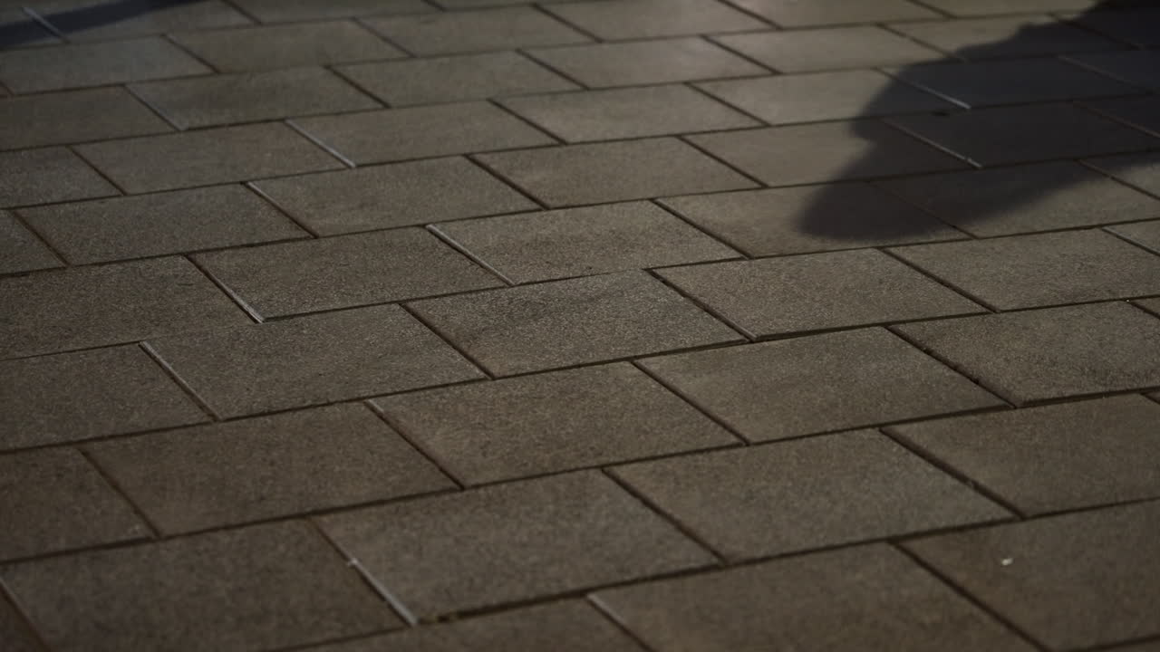 Shadow of two people making shady business deal at night in street alley. Silhouettes of agents or insider moles exchanging envelope and briefcase with bribe hush money. Suspicious white collar scam