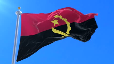 angolan flag waving at wind in slow with blue sky, loop