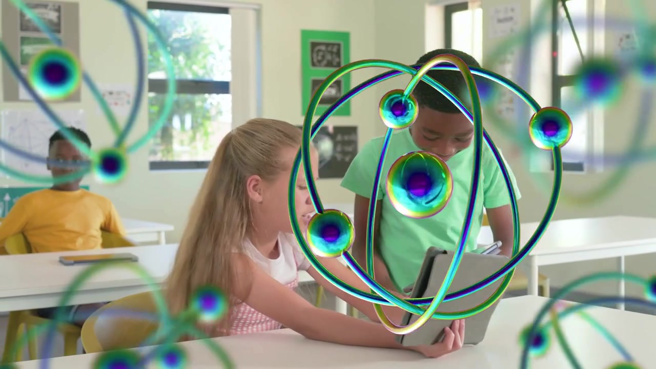 Girl holding tablet; boy in green coming and tapping, creating rotating AR atoms for classroom STEM