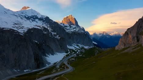 stunning alpine sunrise over winding road