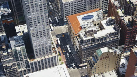 top view of an urban area of manhattan on a sunny day with traffic in the streets, static shot