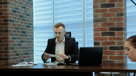 businessman and businesswoman meeting in modern office
