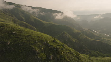 cross on the misty mountains near akhaltsikhe castle in samtskhe-javakheti, georgia