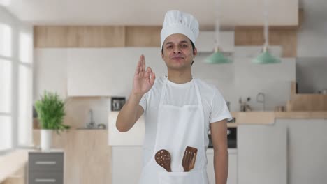 happy indian professional chef showing okay sign