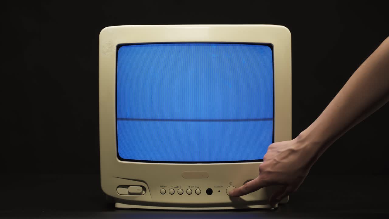 Hand Turning Off Vintage CRT Computer Monitor
