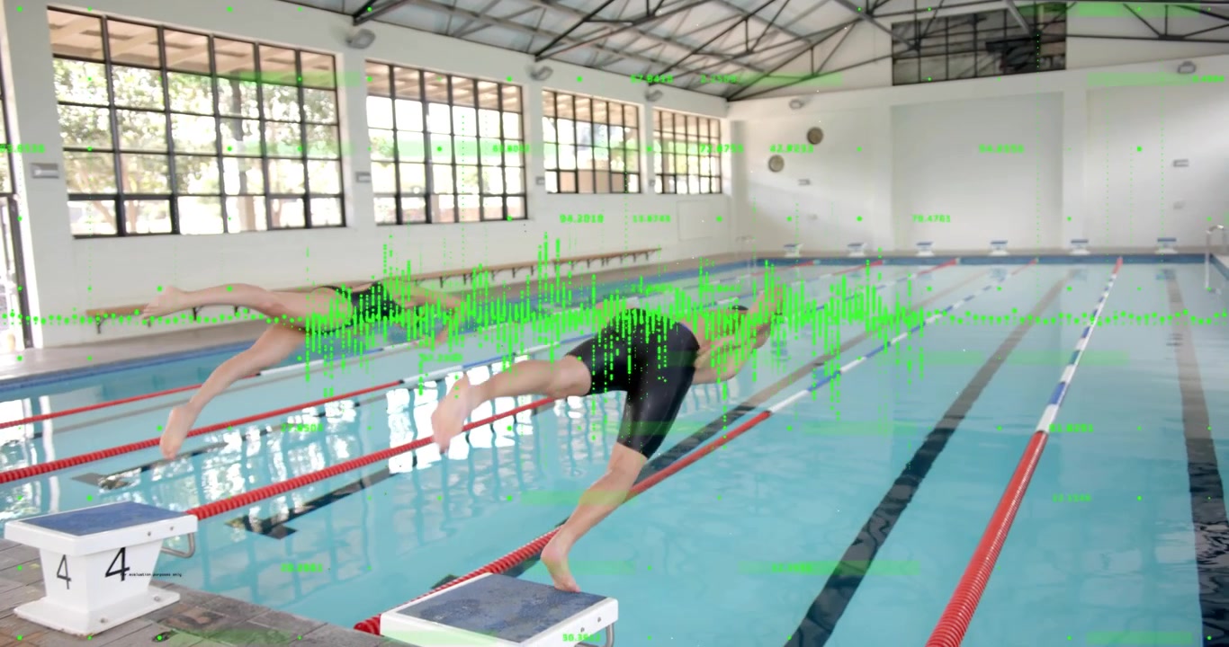 Two swimmers crouching at starting blocks and diving into lanes after start signal for competition