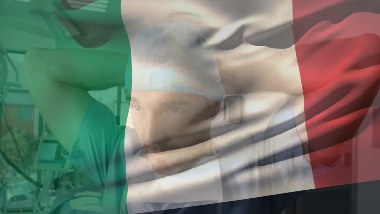 Surgeon preparing for surgery, Italian flag animation overlay in hospital setting
